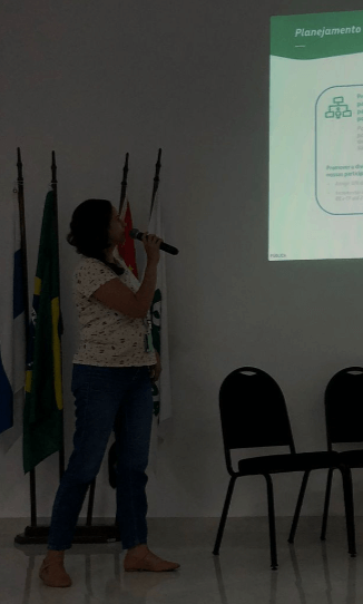Figura 6 - Depois a Nancy apresenta o Planejamento da UTGCA e o por quê do convite, de trazer a mulheres estudantes para conhecer a Unidade e se interessar em trabalhar nela